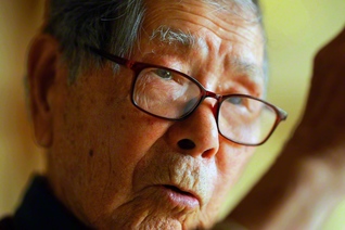 御書の一節をそらんじる中原貞男さん。「深く信心を発して、日夜朝暮にまた懈らず磨くべし」（新317・全384）