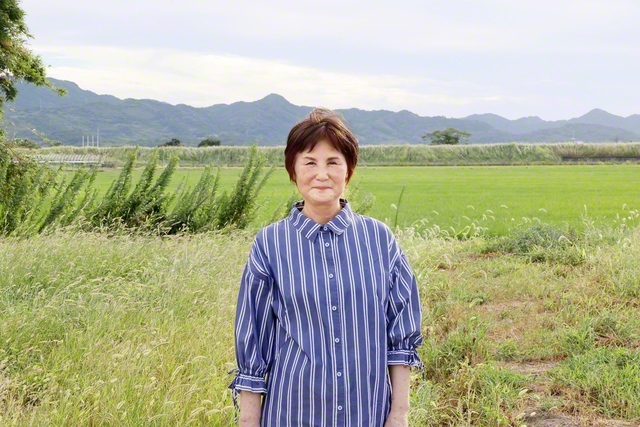 同志と共に励まし合いながら、地域を駆ける名和さん（熊本市・富合町内で）